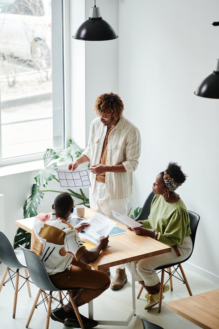 A diverse team of professionals engaged in a productive brainstorming session in a modern office setting.